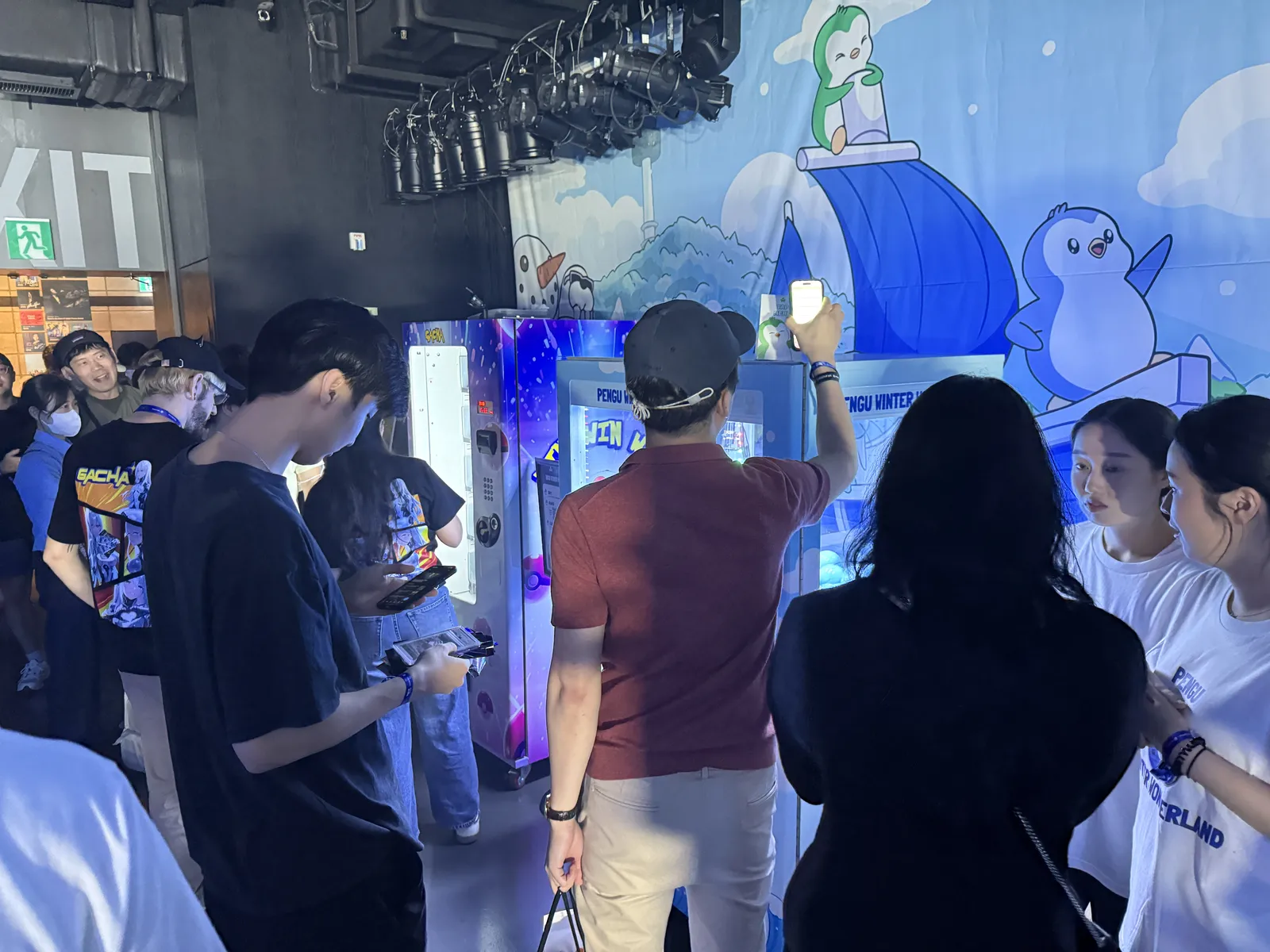 Pudgy Penguins summer event floor — merch handout 3